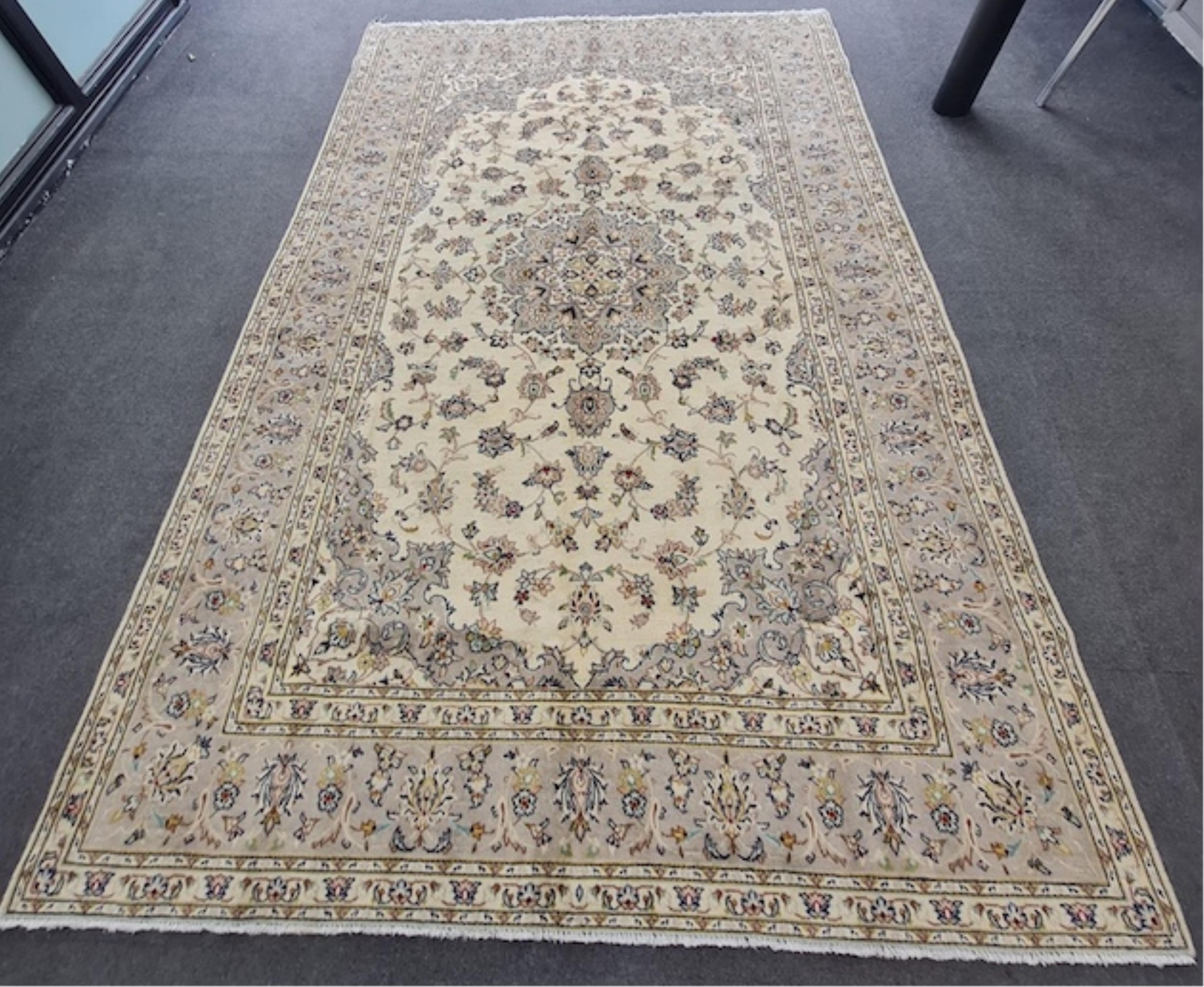 A Kashan ivory ground carpet, 300 x 195cm. Condition - good